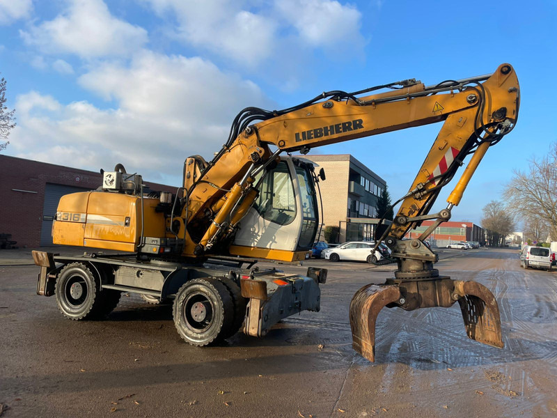 Liebherr A 316 - حفار ذو عجلات: صورة 1 Liebherr A 316 - حفار ذو عجلات: صورة 1