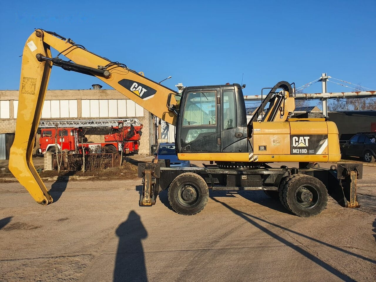 Caterpillar 318 D MH - آلة التعامل مع النفايات: صورة 1 Caterpillar 318 D MH - آلة التعامل مع النفايات: صورة 1