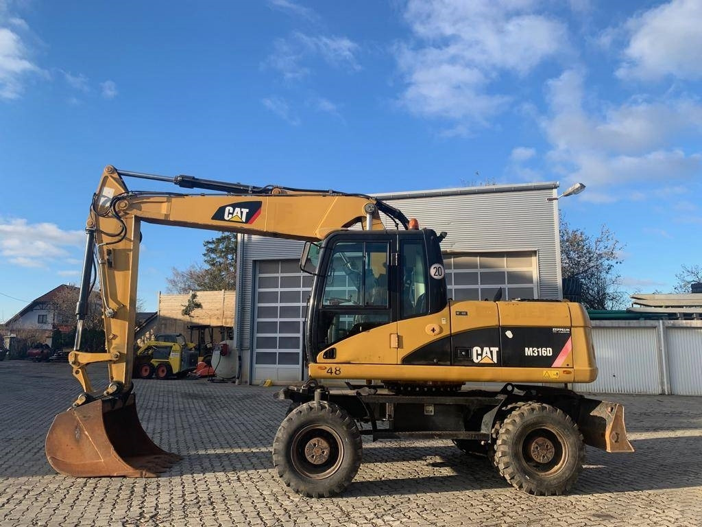 CAT M 316 D - حفار ذو عجلات: صورة 2 CAT M 316 D - حفار ذو عجلات: صورة 2