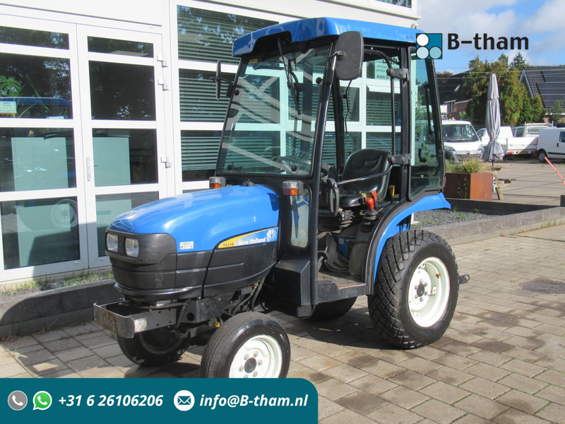 New Holland TC21D 4WD 4x4 Cabine Verwarming - جرار: صورة 1 New Holland TC21D 4WD 4x4 Cabine Verwarming - جرار: صورة 1