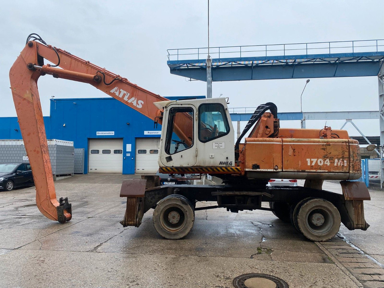 Atlas 1704 MI mit Greifer Umschlagbagger Lang - حفار ذو عجلات: صورة 1 Atlas 1704 MI mit Greifer Umschlagbagger Lang - حفار ذو عجلات: صورة 1