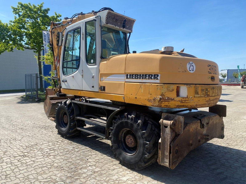 Liebherr A316 Litronic NVT - حفار ذو عجلات: صورة 1 Liebherr A316 Litronic NVT - حفار ذو عجلات: صورة 1