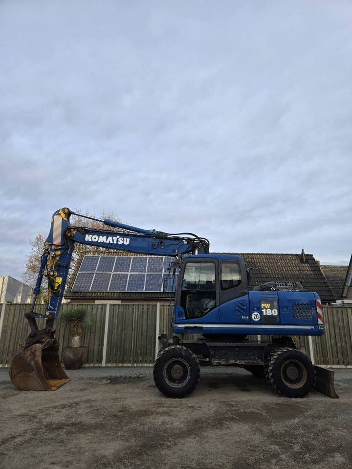 Komatsu PW 180-7EO - حفار ذو عجلات: صورة 1 Komatsu PW 180-7EO - حفار ذو عجلات: صورة 1