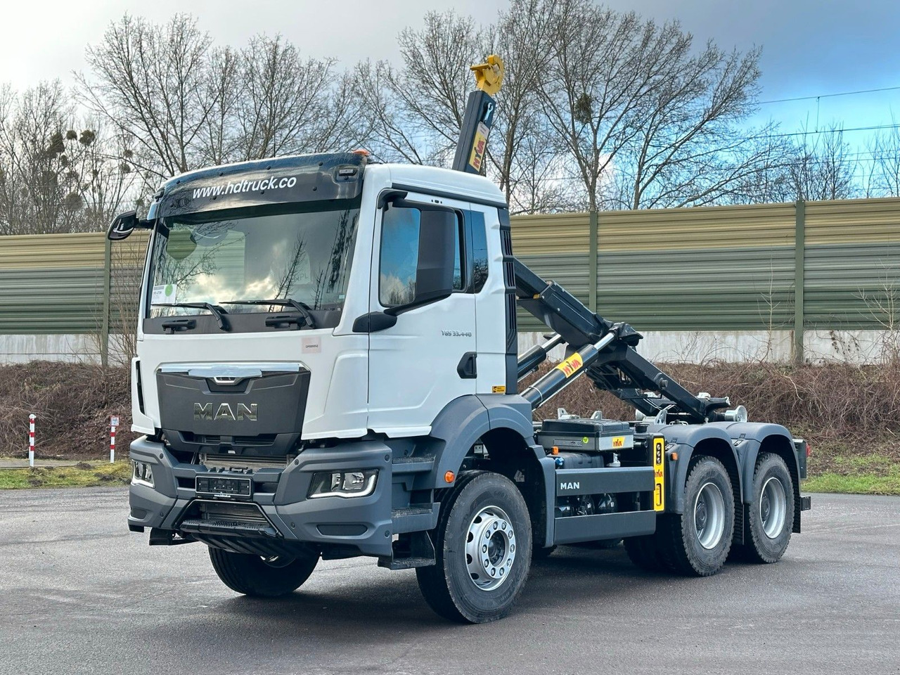 MAN TGS 33.440 6x4 Euro6e Abrollkipper Hyva - شاحنة برافعة خطافية, شاحنة كرين: صورة 1 MAN TGS 33.440 6x4 Euro6e Abrollkipper Hyva - شاحنة برافعة خطافية, شاحنة كرين: صورة 1