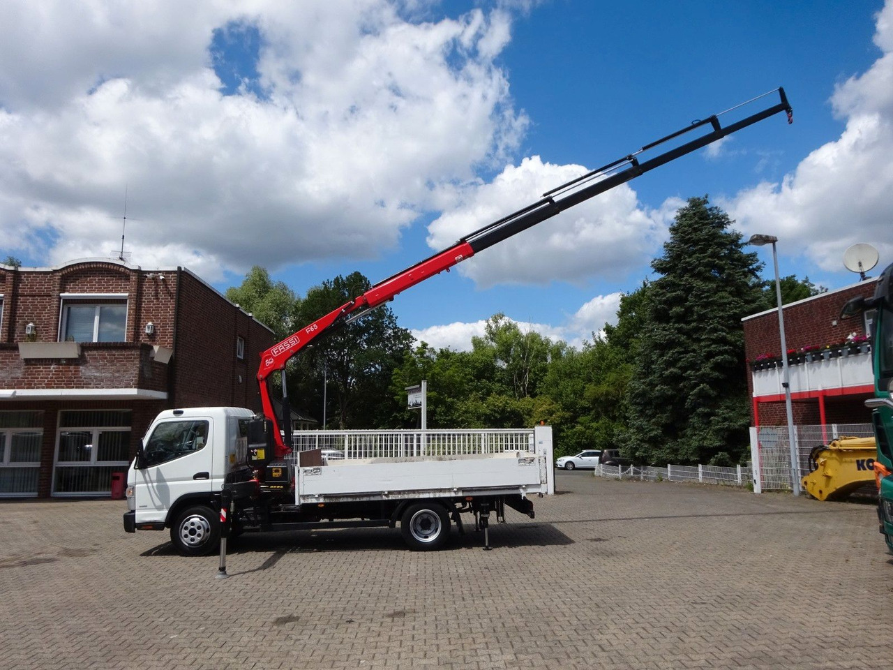 FUSO Canter 7C15 mit FASSI F65A Kran - شاحنة توصيل مفتوحة: صورة 4 FUSO Canter 7C15 mit FASSI F65A Kran - شاحنة توصيل مفتوحة: صورة 4