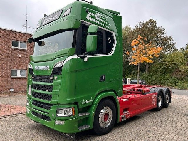 Scania S580 V8 MEILLER Abroller mit Lift+Lenkachse 6x2 - شاحنة برافعة خطافية: صورة 1 Scania S580 V8 MEILLER Abroller mit Lift+Lenkachse 6x2 - شاحنة برافعة خطافية: صورة 1