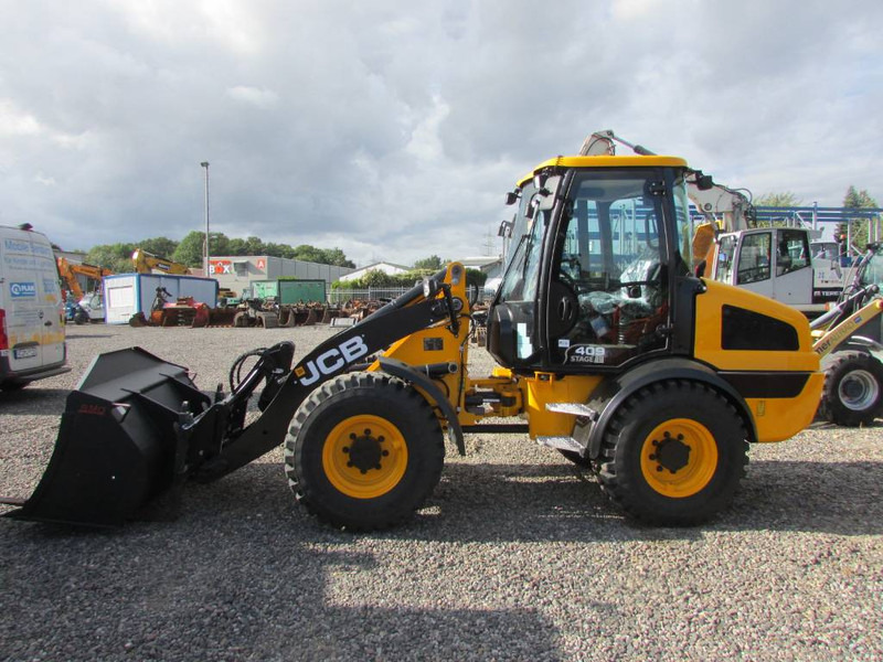 JCB 409 Radlader 46.500 EUR - اللودر بعجل: صورة 1 JCB 409 Radlader 46.500 EUR - اللودر بعجل: صورة 1