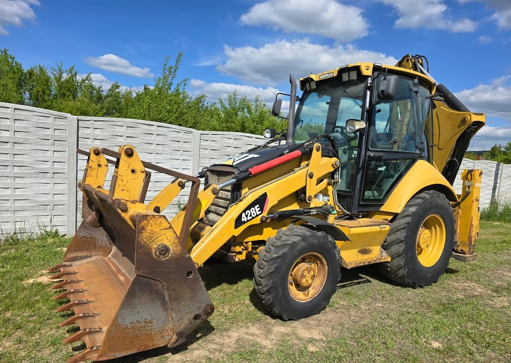 Caterpillar - لودر ذو محراث خلفي/ باكهو: صورة 1 Caterpillar - لودر ذو محراث خلفي/ باكهو: صورة 1