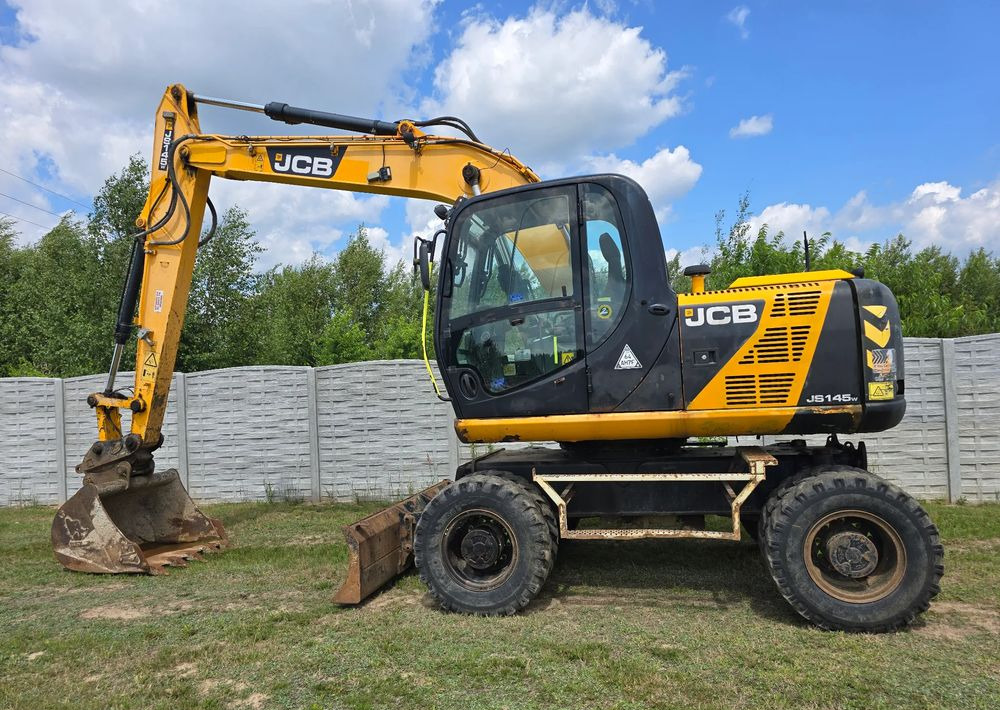 JCB - حفار ذو عجلات: صورة 1 JCB - حفار ذو عجلات: صورة 1