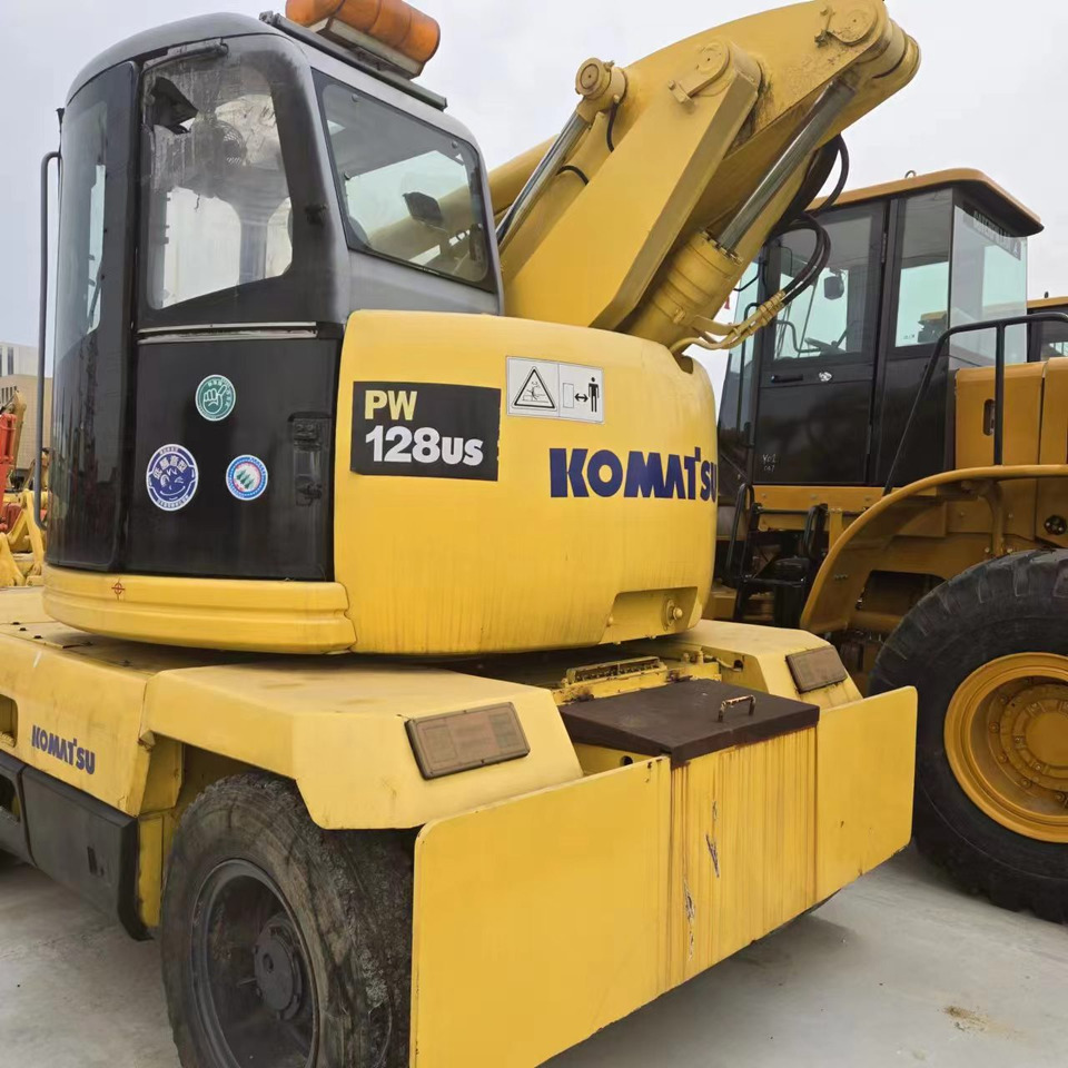 KOMATSU PC128US - حفار ذو عجلات: صورة 4 KOMATSU PC128US - حفار ذو عجلات: صورة 4