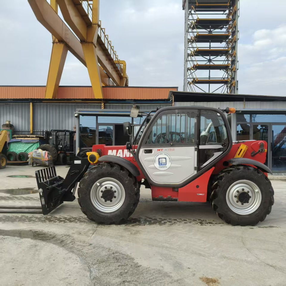 MANITOU MT-X732 - آلة رفع ونقل تلسكوبية: صورة 1 MANITOU MT-X732 - آلة رفع ونقل تلسكوبية: صورة 1