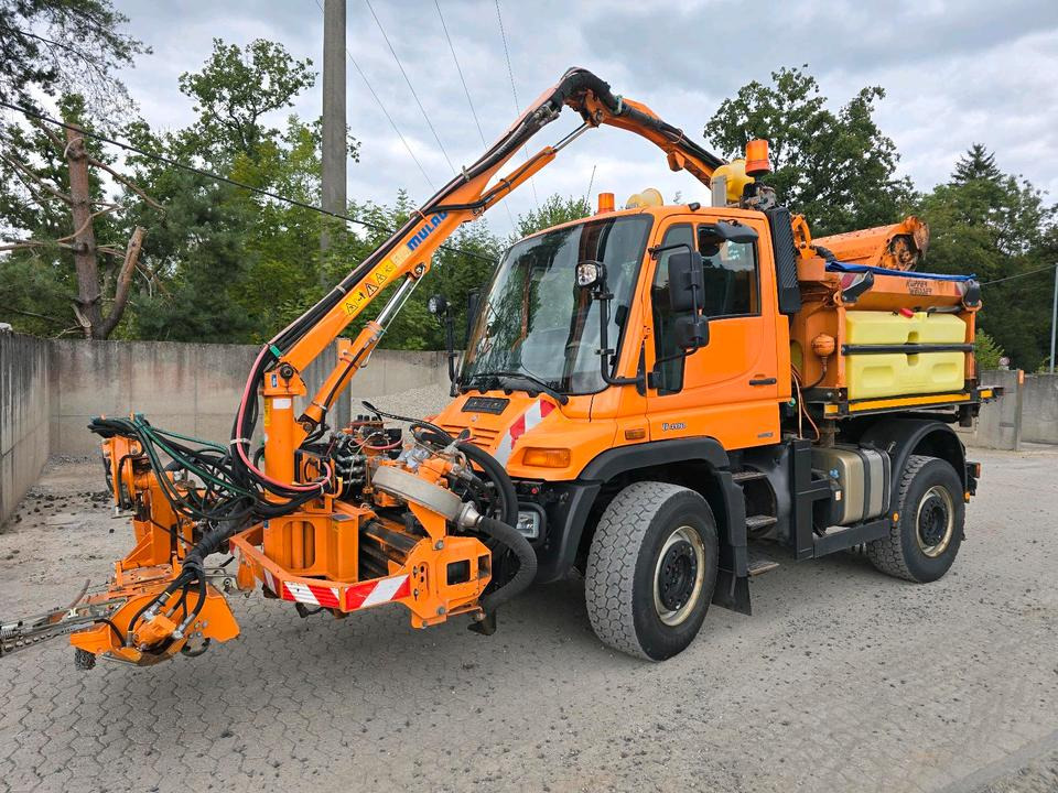 Unimog U400 2013 405/10 405/12 NKS-Z-UGN-43K Bluetec 5 Mercedes-Benz UGE UGN Mulag MKM700 Mähausleger Böschungsmäher Böschungsmulcher Küpper-Weisser IMS Salzstreuer - جرافة ثلج: صورة 1 Unimog U400 2013 405/10 405/12 NKS-Z-UGN-43K Bluetec 5 Mercedes-Benz UGE UGN Mulag MKM700 Mähausleger Böschungsmäher Böschungsmulcher Küpper-Weisser IMS Salzstreuer - جرافة ثلج: صورة 1