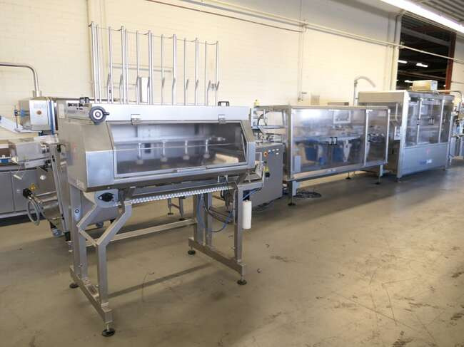 Tramper filling- and traysealing line GMD99-2 - آلة التعبئة والتغليف: صورة 1 Tramper filling- and traysealing line GMD99-2 - آلة التعبئة والتغليف: صورة 1