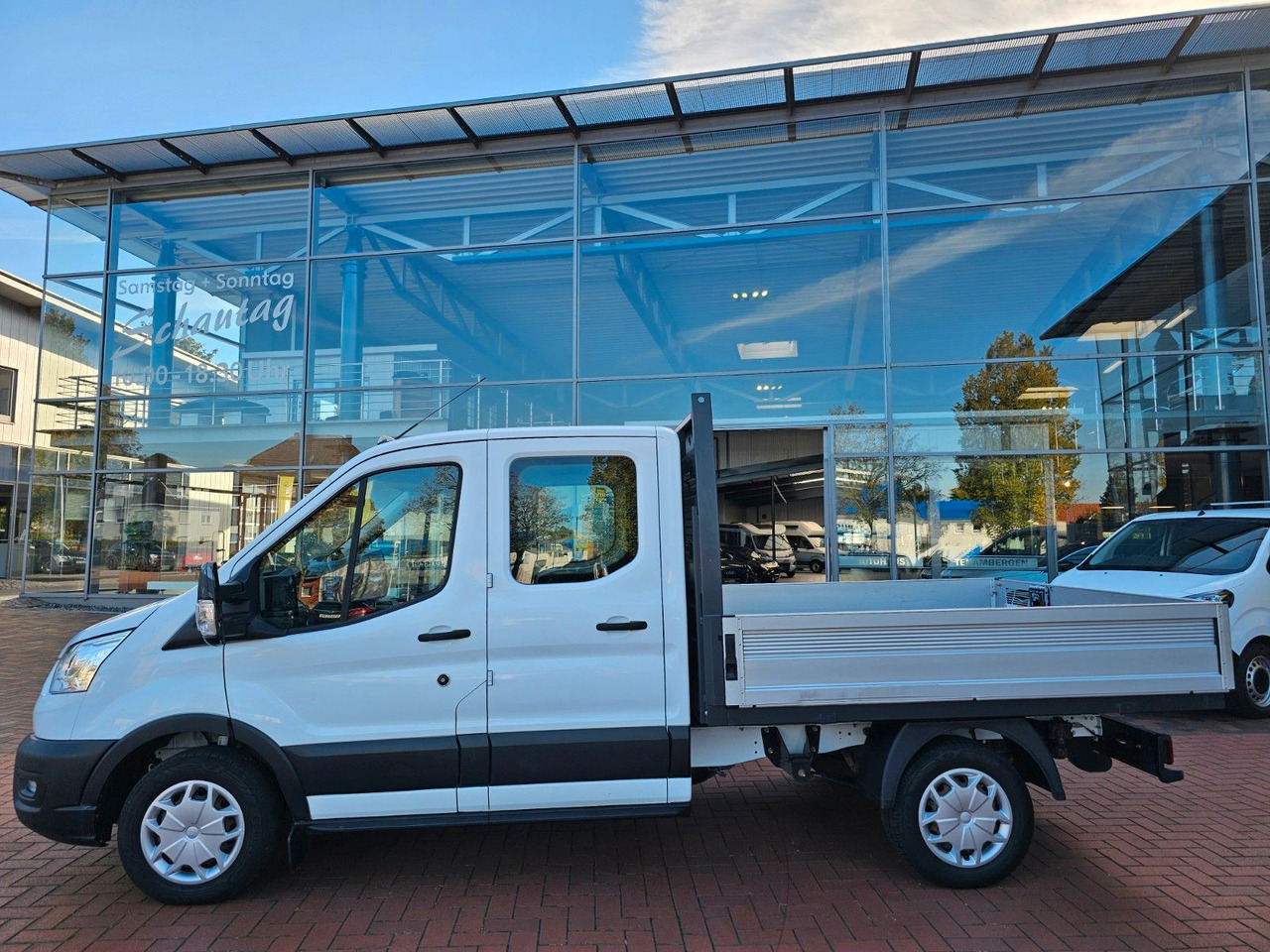 Ford Transit Pritsche 310 DoKa AHK Klima 7 Sitzer - شاحنة توصيل مفتوحة, الشاحنات الصغيرة كابينة مزدوجة: صورة 2 Ford Transit Pritsche 310 DoKa AHK Klima 7 Sitzer - شاحنة توصيل مفتوحة, الشاحنات الصغيرة كابينة مزدوجة: صورة 2
