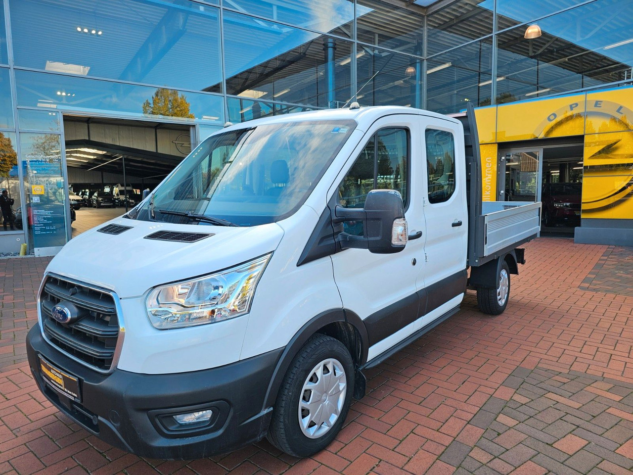 Ford Transit Pritsche 310 DoKa AHK Klima 7 Sitzer - شاحنة توصيل مفتوحة, الشاحنات الصغيرة كابينة مزدوجة: صورة 1 Ford Transit Pritsche 310 DoKa AHK Klima 7 Sitzer - شاحنة توصيل مفتوحة, الشاحنات الصغيرة كابينة مزدوجة: صورة 1