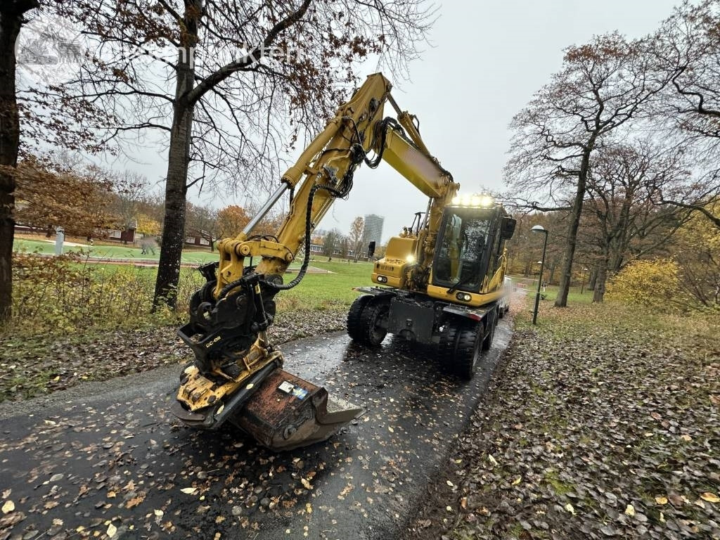 Komatsu PW 148-11 med vagn och redskap - حفار ذو عجلات: صورة 2 Komatsu PW 148-11 med vagn och redskap - حفار ذو عجلات: صورة 2