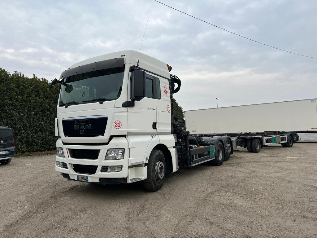 MAN TGX 26.480 SCARRABILE CON GRU - شاحنة برافعة خطافية, شاحنة كرين: صورة 1 MAN TGX 26.480 SCARRABILE CON GRU - شاحنة برافعة خطافية, شاحنة كرين: صورة 1