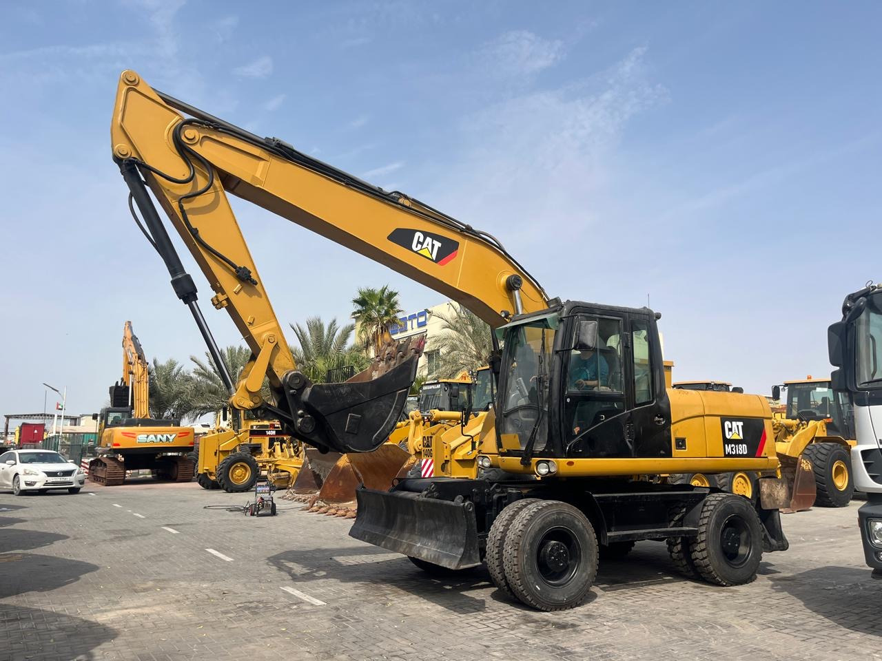 CATERPILLAR M318D - حفار ذو عجلات: صورة 1 CATERPILLAR M318D - حفار ذو عجلات: صورة 1