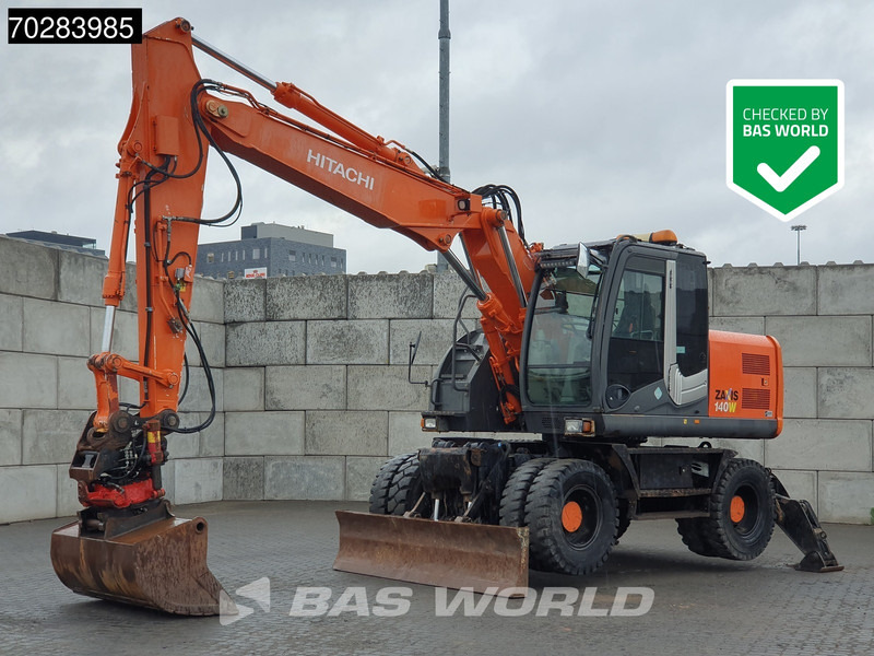 Hitachi ZX140W -3 OUTRIGGERS - ROTOTILT - حفار ذو عجلات: صورة 1 Hitachi ZX140W -3 OUTRIGGERS - ROTOTILT - حفار ذو عجلات: صورة 1
