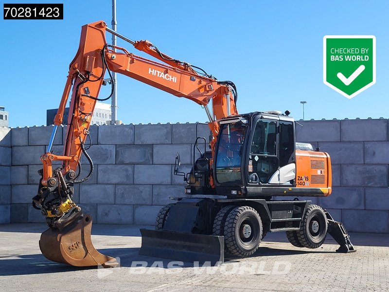 Hitachi ZX140W -5 OUTRIGGERS + BLADE - حفار ذو عجلات: صورة 1 Hitachi ZX140W -5 OUTRIGGERS + BLADE - حفار ذو عجلات: صورة 1
