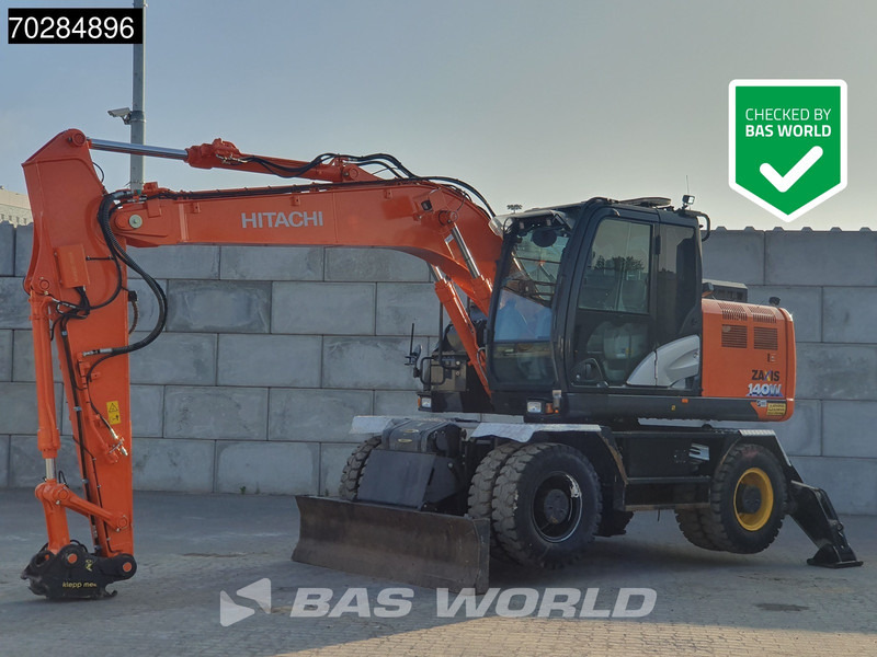 Hitachi ZX140W -6 OUTRIGGERS + BLADE - حفار ذو عجلات: صورة 1 Hitachi ZX140W -6 OUTRIGGERS + BLADE - حفار ذو عجلات: صورة 1