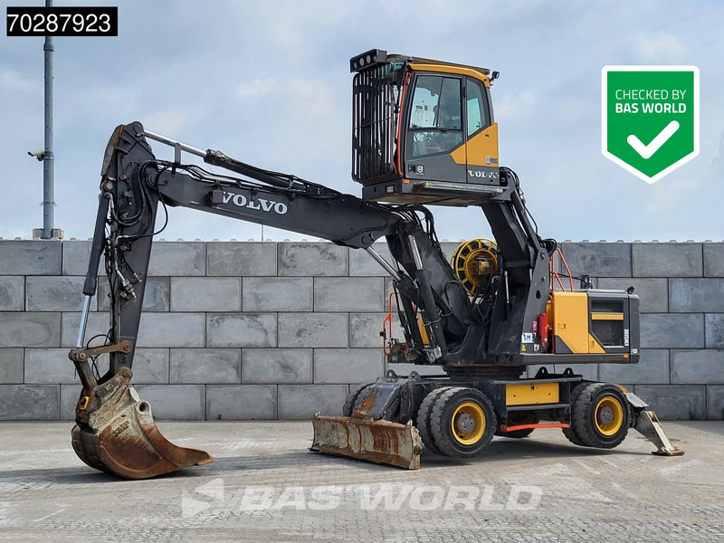 Volvo EW220 E - حفار ذو عجلات: صورة 1 Volvo EW220 E - حفار ذو عجلات: صورة 1