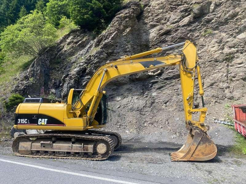 Caterpillar 315CL - حفار زاحف: صورة 1 Caterpillar 315CL - حفار زاحف: صورة 1