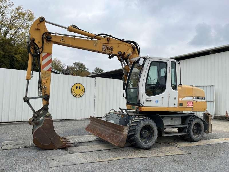 Liebherr Pelle sur Pneus A314 LITRONIC - حفار ذو عجلات: صورة 1 Liebherr Pelle sur Pneus A314 LITRONIC - حفار ذو عجلات: صورة 1
