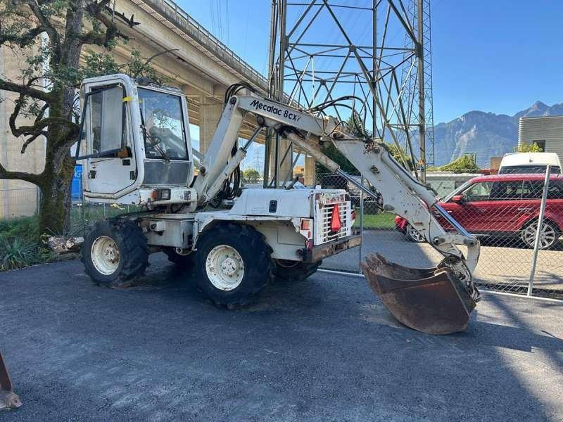 Mecalac 8CXI - حفار ذو عجلات: صورة 1 Mecalac 8CXI - حفار ذو عجلات: صورة 1