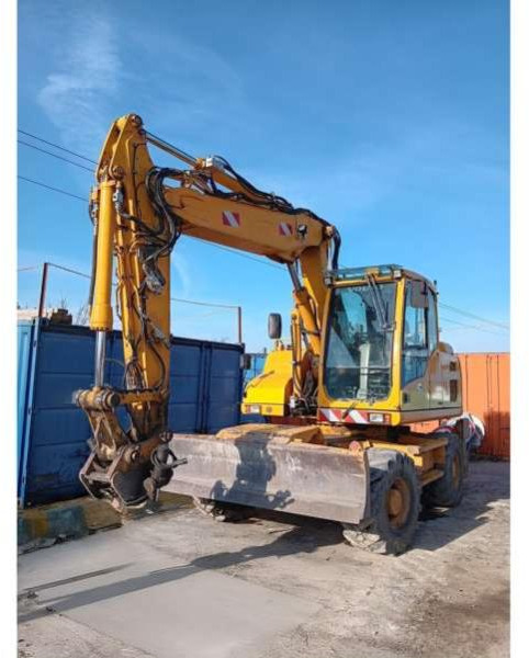 Volvo EW140D - حفار ذو عجلات: صورة 1 Volvo EW140D - حفار ذو عجلات: صورة 1