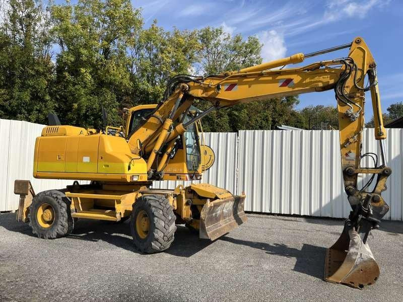 Volvo EW140D - حفار ذو عجلات: صورة 1 Volvo EW140D - حفار ذو عجلات: صورة 1