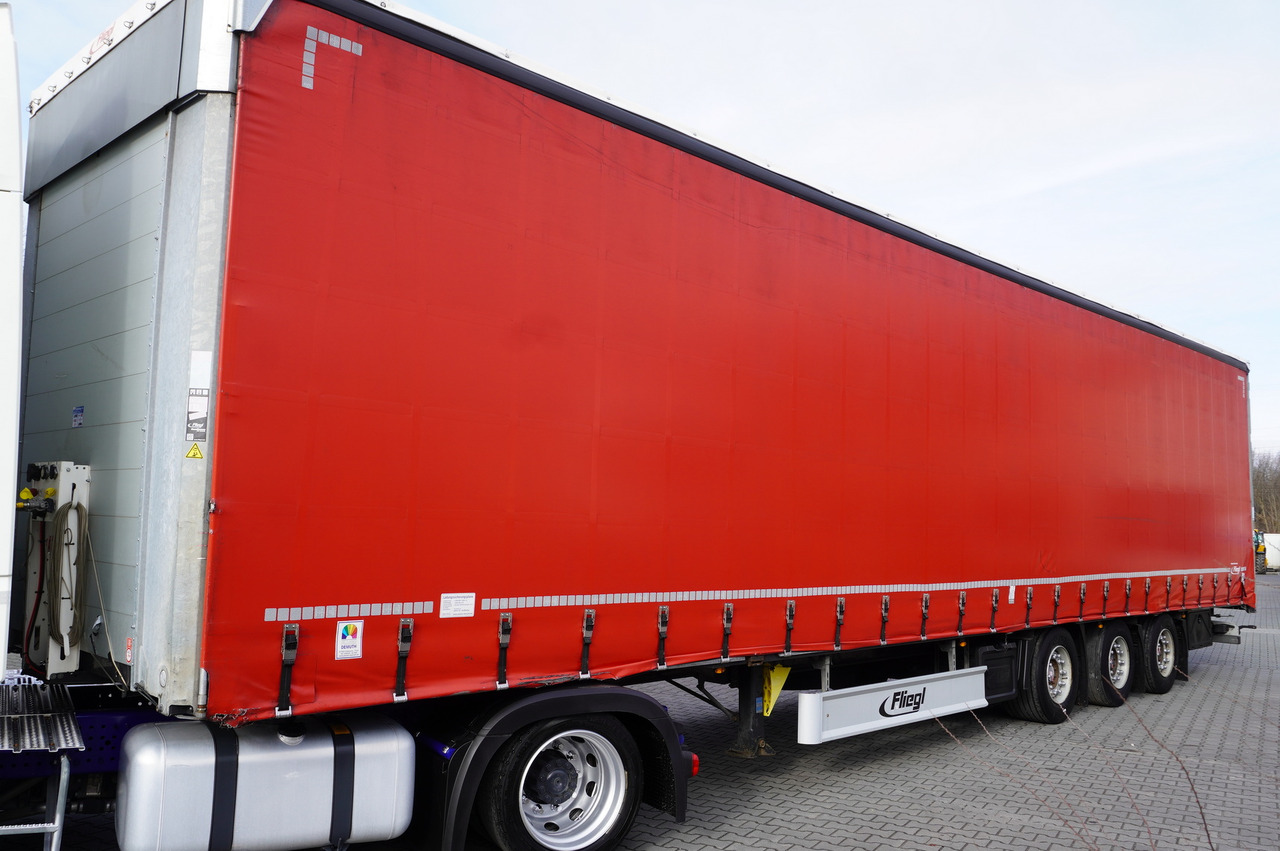 FLIEGL SDS 01 Coilmulde semi-trailer - نصف مقطورة بستائر جانبية: صورة 1 FLIEGL SDS 01 Coilmulde semi-trailer - نصف مقطورة بستائر جانبية: صورة 1