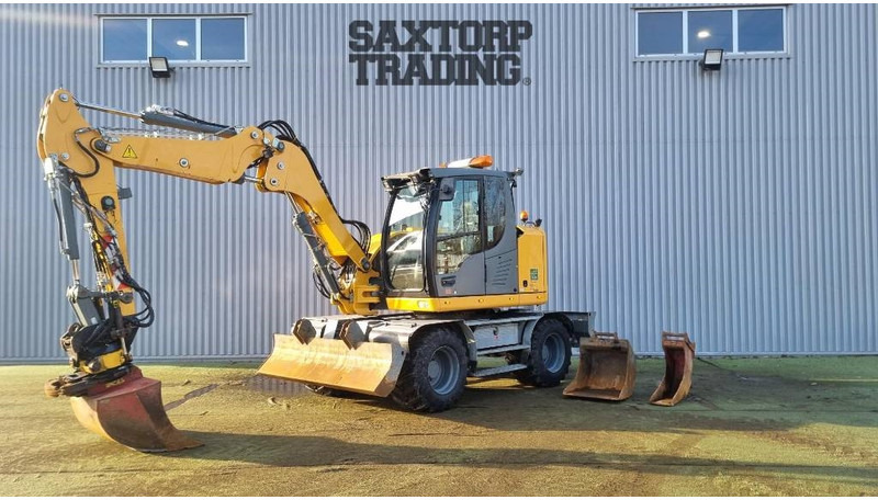 Liebherr A910 Compact, Hjulgrävare - حفار ذو عجلات: صورة 1 Liebherr A910 Compact, Hjulgrävare - حفار ذو عجلات: صورة 1