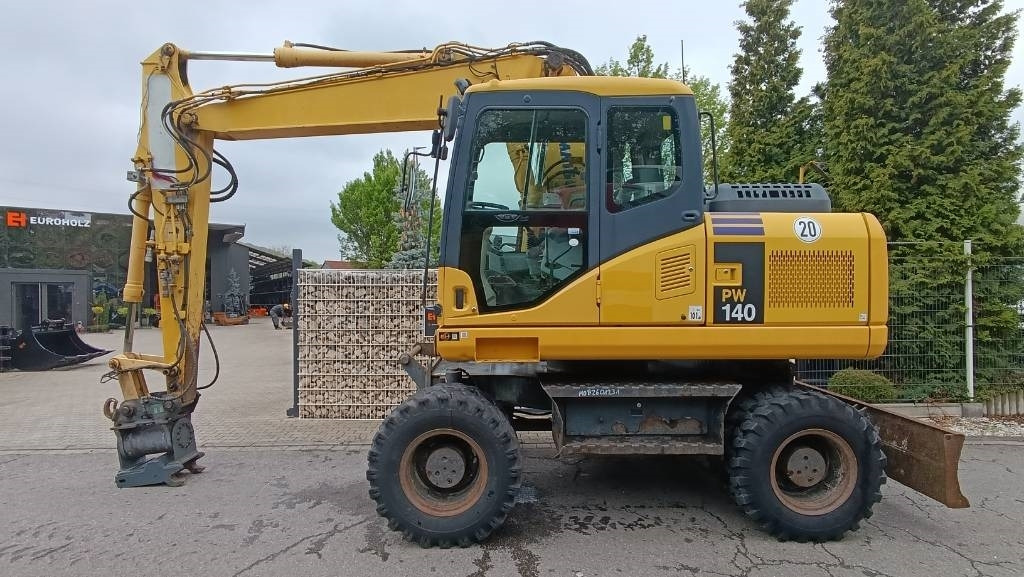 Komatsu PW 140 Mobilbagger Powertilt Schnellwechsler MS 10 - حفار ذو عجلات: صورة 1 Komatsu PW 140 Mobilbagger Powertilt Schnellwechsler MS 10 - حفار ذو عجلات: صورة 1