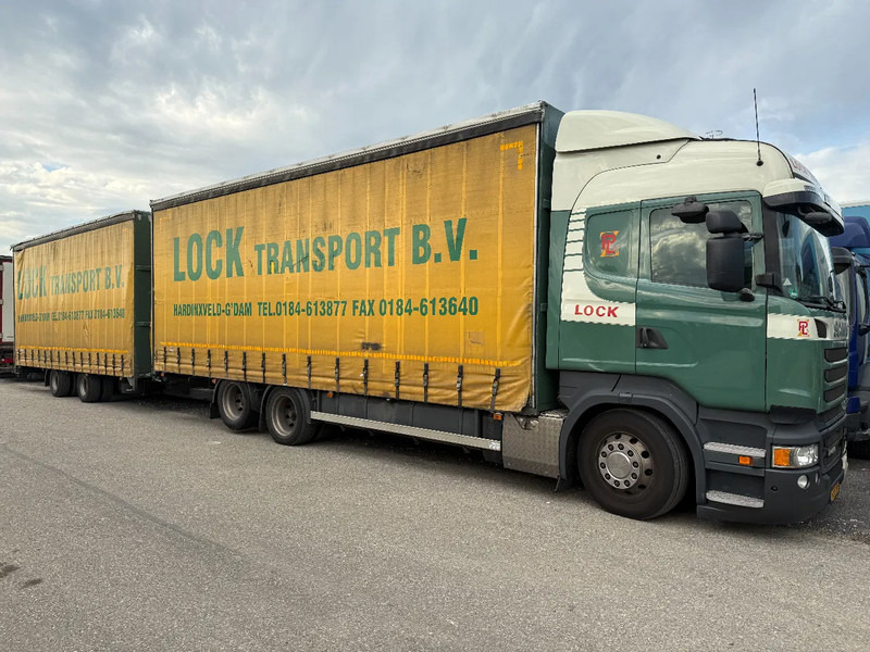Scania R450 6X2 + DRACO AANHANGER 2010 TUV TILL 17-08-2026 - شاحنة ذات ستائر جانبية: صورة 1 Scania R450 6X2 + DRACO AANHANGER 2010 TUV TILL 17-08-2026 - شاحنة ذات ستائر جانبية: صورة 1