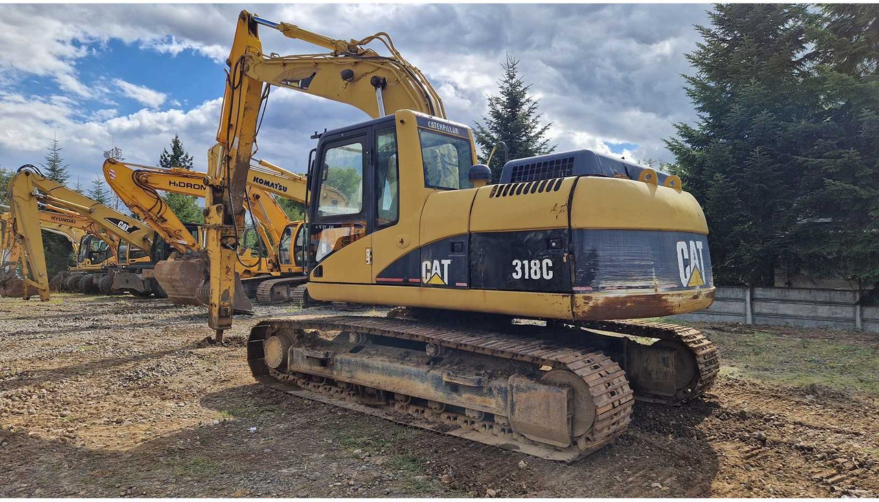 Caterpillar 318C - حفار زاحف: صورة 1 Caterpillar 318C - حفار زاحف: صورة 1
