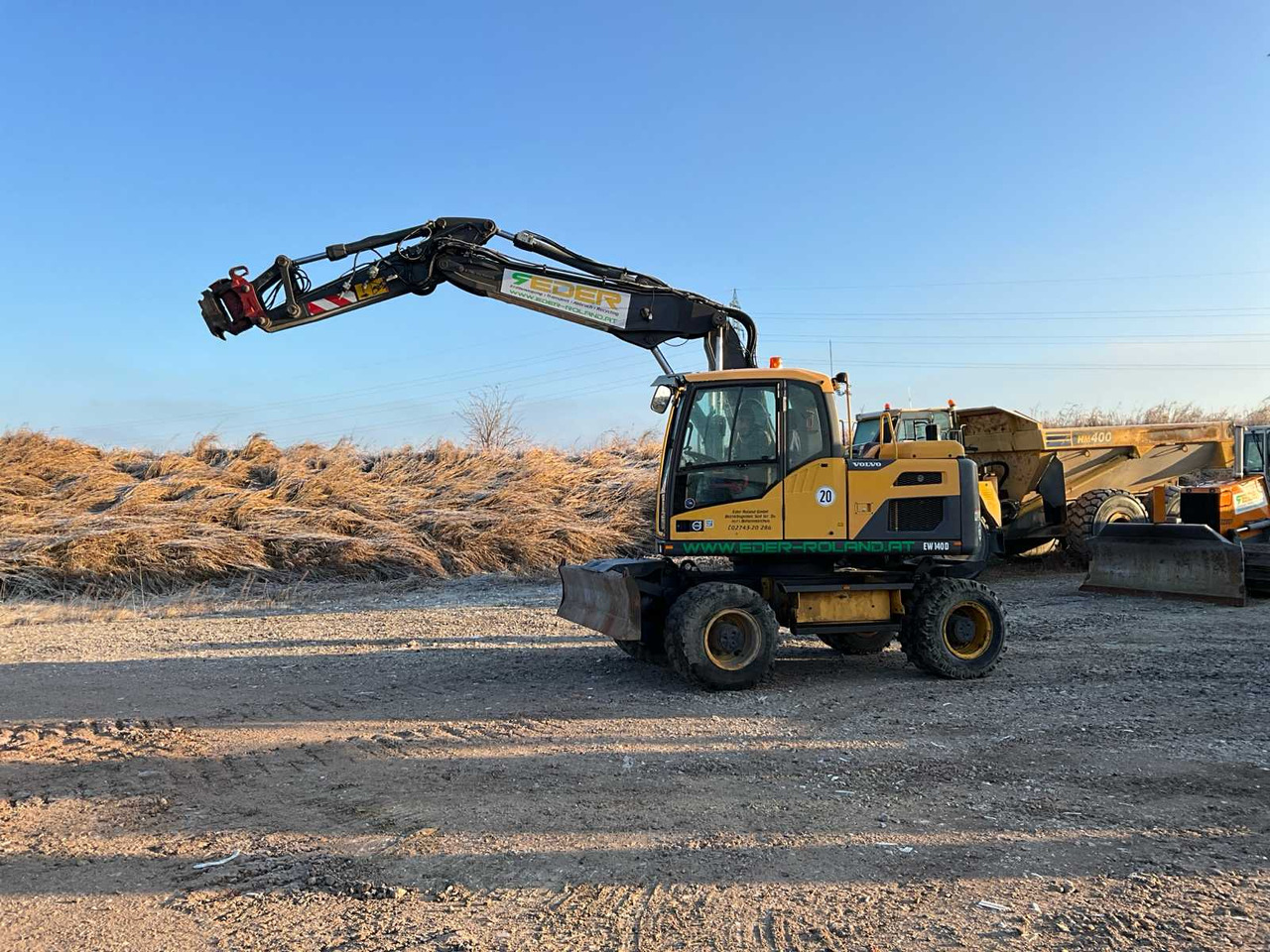 Volvo EXCAVATOR EW140D - حفار ذو عجلات: صورة 1 Volvo EXCAVATOR EW140D - حفار ذو عجلات: صورة 1