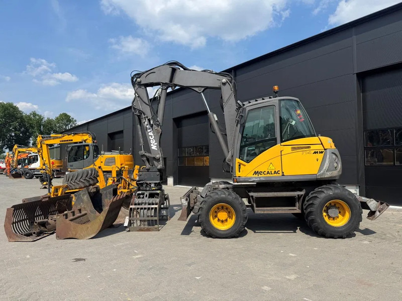 Mecalac 714MW FULL ATTACHMENTS OVERCOMPLEET !!! - حفار ذو عجلات: صورة 1 Mecalac 714MW FULL ATTACHMENTS OVERCOMPLEET !!! - حفار ذو عجلات: صورة 1