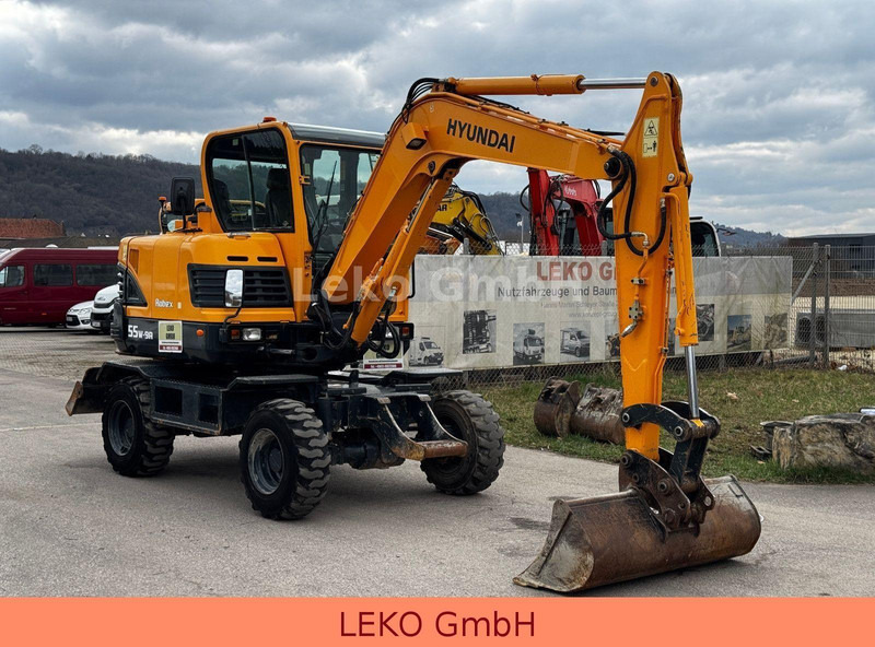 Hyundai Robex 55W-9A Mit Drei Löffeln - حفار ذو عجلات: صورة 1 Hyundai Robex 55W-9A Mit Drei Löffeln - حفار ذو عجلات: صورة 1