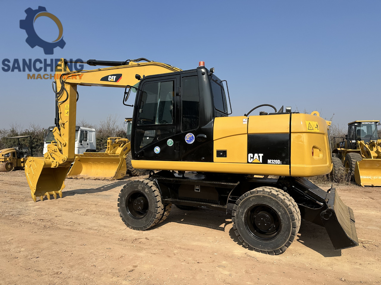 CATERPILLAR M320D2 - حفار ذو عجلات: صورة 1 CATERPILLAR M320D2 - حفار ذو عجلات: صورة 1