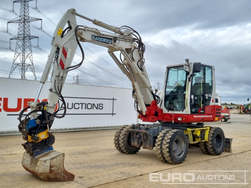 2021 Takeuchi TB295W - حفار ذو عجلات: صورة 1 2021 Takeuchi TB295W - حفار ذو عجلات: صورة 1