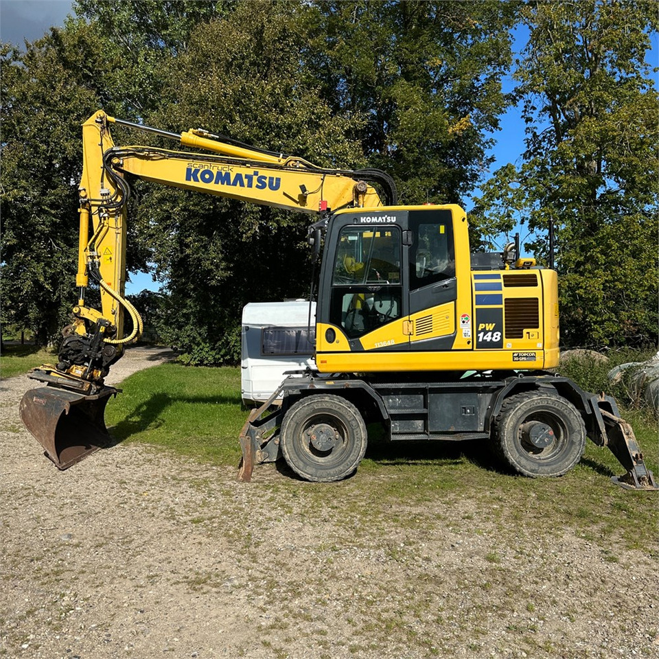 Komatsu PW148-11 - حفار ذو عجلات: صورة 1 Komatsu PW148-11 - حفار ذو عجلات: صورة 1