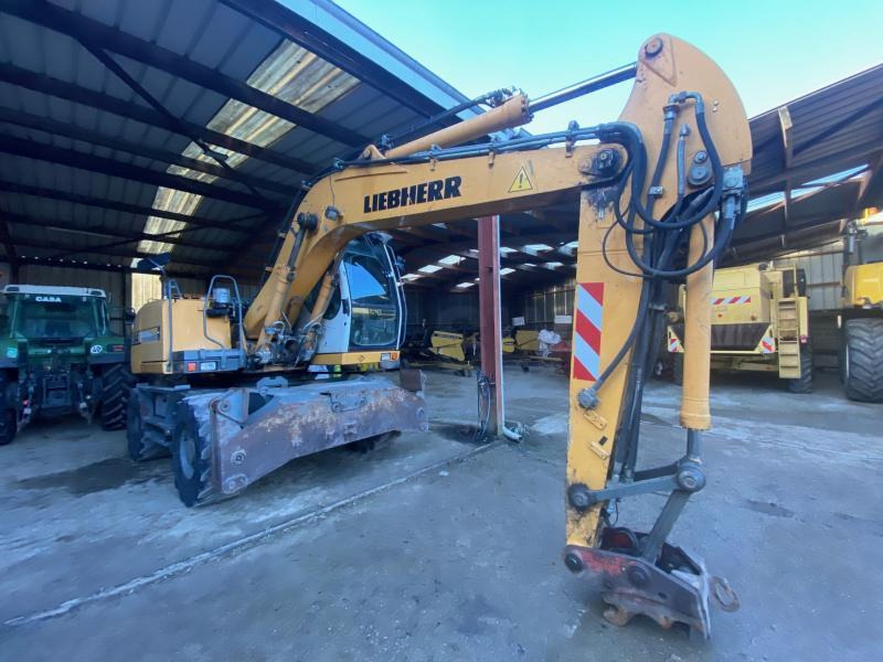 Liebherr A314 Litronic - حفار ذو عجلات: صورة 1 Liebherr A314 Litronic - حفار ذو عجلات: صورة 1