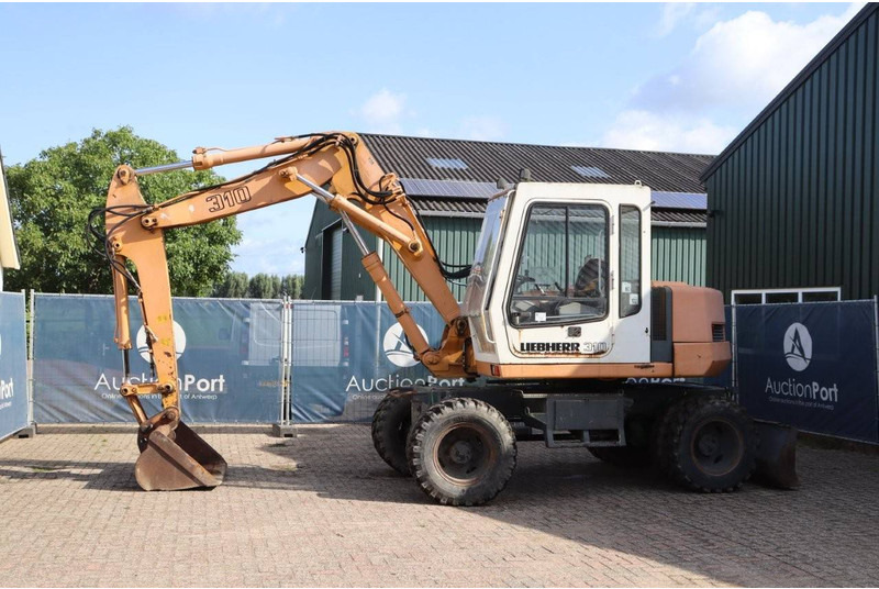 Liebherr A 310 - حفار ذو عجلات: صورة 1 Liebherr A 310 - حفار ذو عجلات: صورة 1